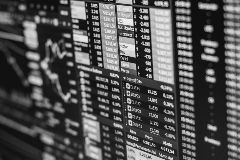 Black and white stock exchange screen listing brokers, share prices and market data